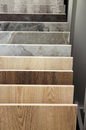 Photo of Many different samples of tiles on display in store, closeup