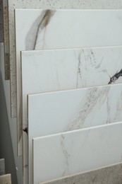 Photo of Many different samples of tiles on display in store, closeup