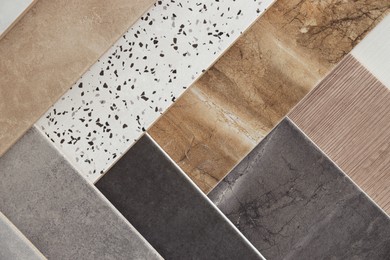 Photo of Many different samples of tiles as background, top view