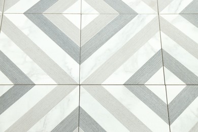 Photo of Texture of tiles with beautiful pattern as background, above view