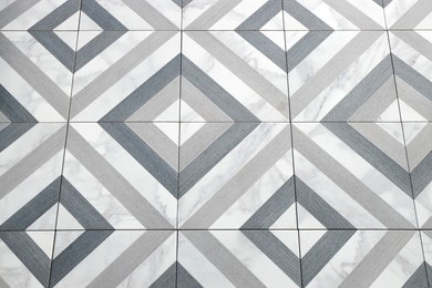 Photo of Texture of tiles with beautiful pattern as background, closeup
