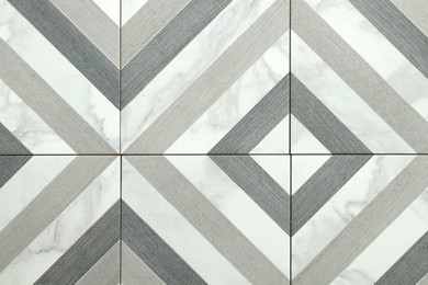 Photo of Texture of tiles with beautiful pattern as background, top view