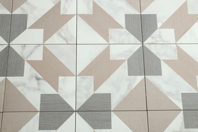 Photo of Texture of tiles with beautiful pattern as background, above view
