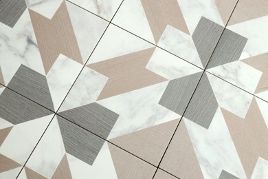 Photo of Texture of tiles with beautiful pattern as background, top view