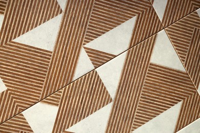 Photo of Texture of tiles with beautiful pattern as background, top view