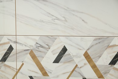 Photo of Texture of tiles with beautiful pattern as background, top view