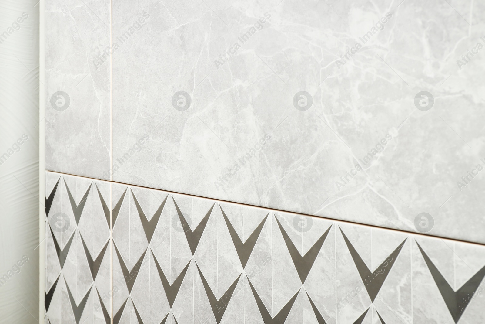 Samples of tiles with beautiful patterns on display in store, closeup Photo of Samples of tiles with beautiful patterns on display in store, closeup