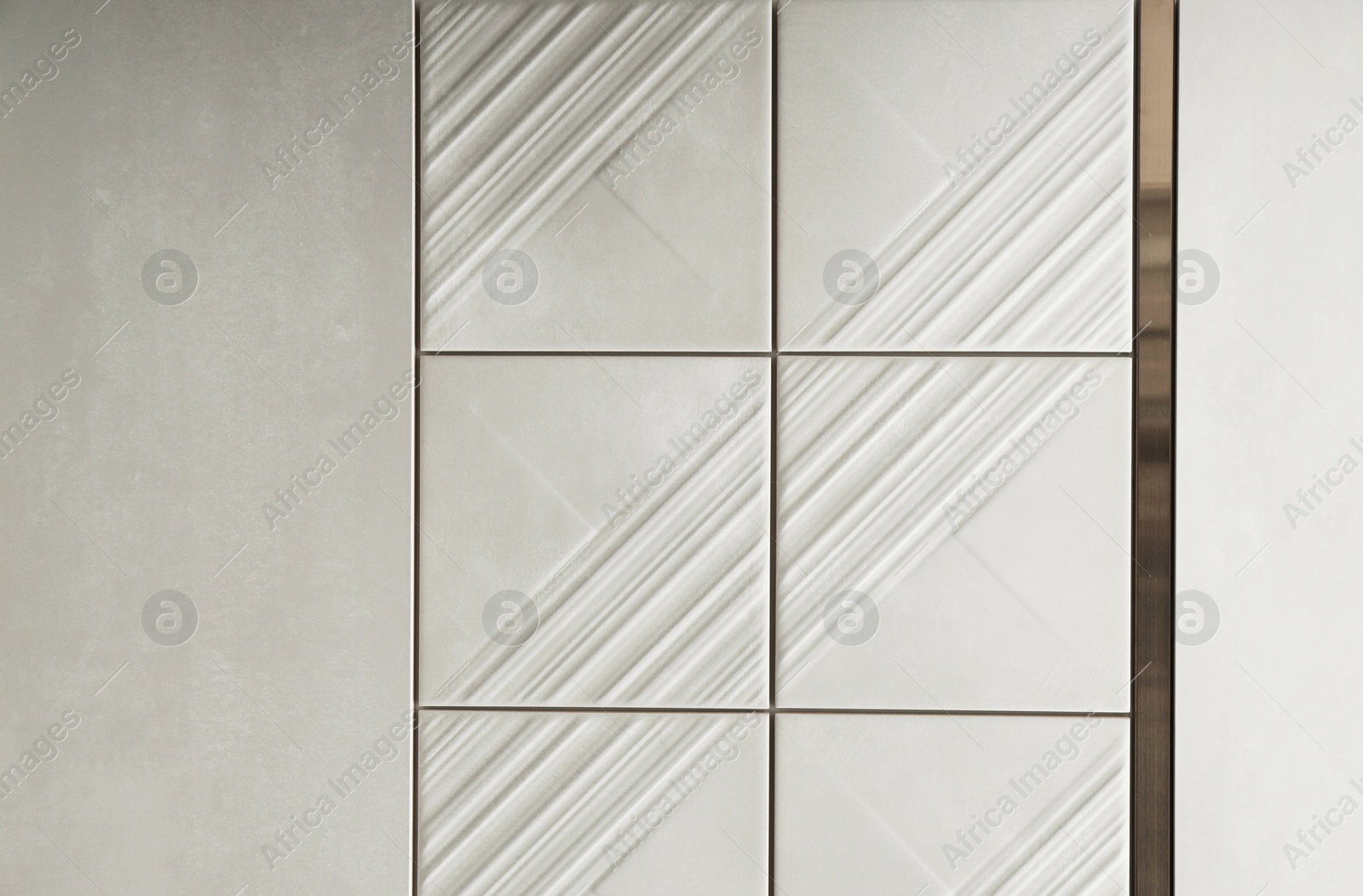 Samples of beige tiles on display in store Photo of Samples of beige tiles on display in store