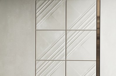Photo of Samples of beige tiles on display in store