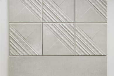 Photo of Samples of beige tiles on display in store