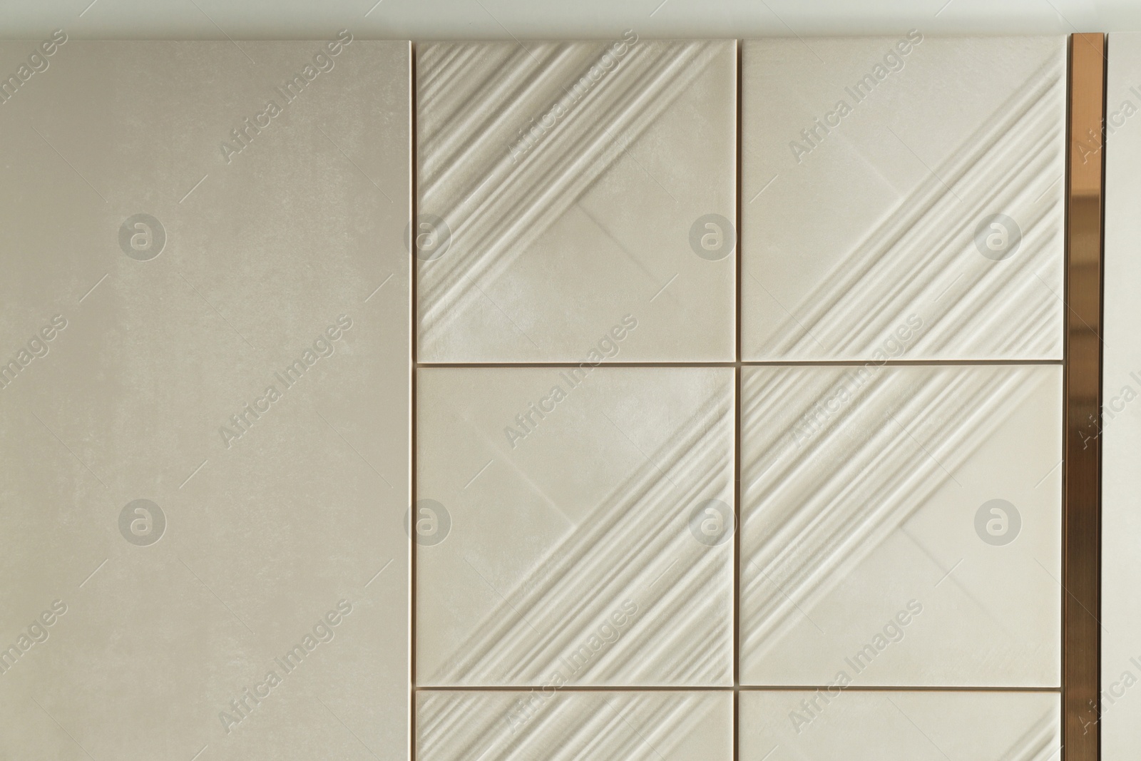 Samples of beige tiles on display in store Photo of Samples of beige tiles on display in store