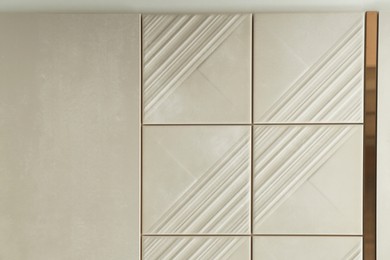Photo of Samples of beige tiles on display in store