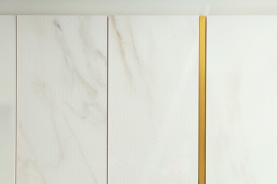Photo of Samples of tiles with different patterns on display in store