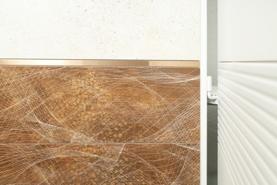 Photo of Samples of tiles with different patterns on display in store, closeup