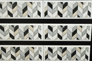 Photo of Samples of tiles with beautiful pattern as background, closeup