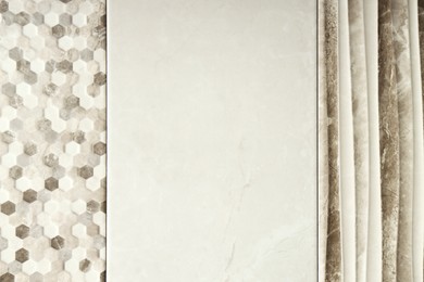 Photo of Samples of tiles with different patterns as background, closeup