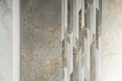 Photo of Samples of tiles with different patterns on display in store