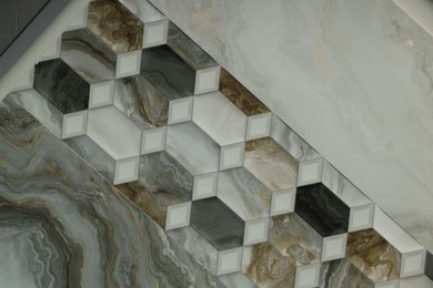 Photo of Texture of tiles with different patterns as background, top view