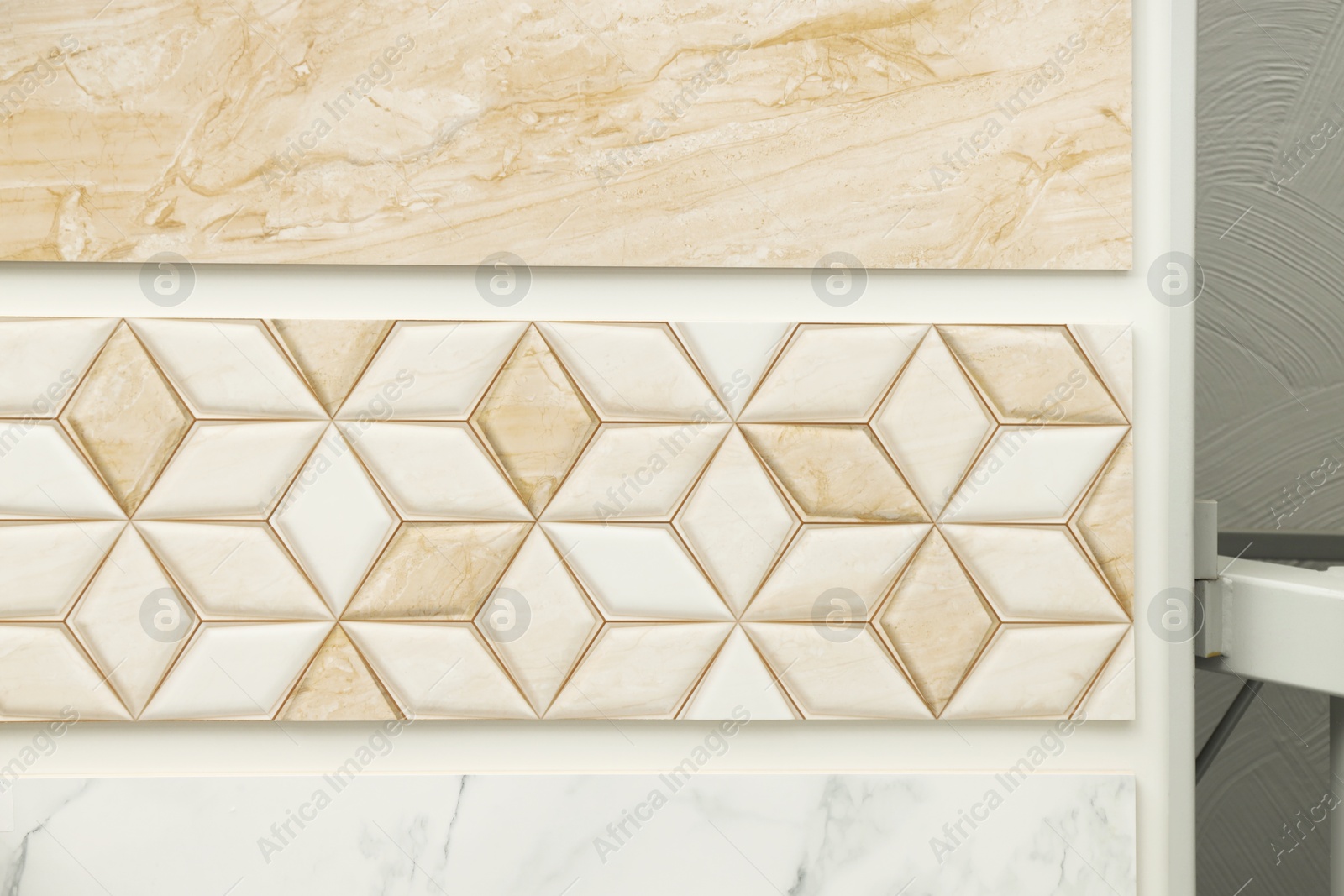 Samples of tiles with different patterns on display in store Photo of Samples of tiles with different patterns on display in store