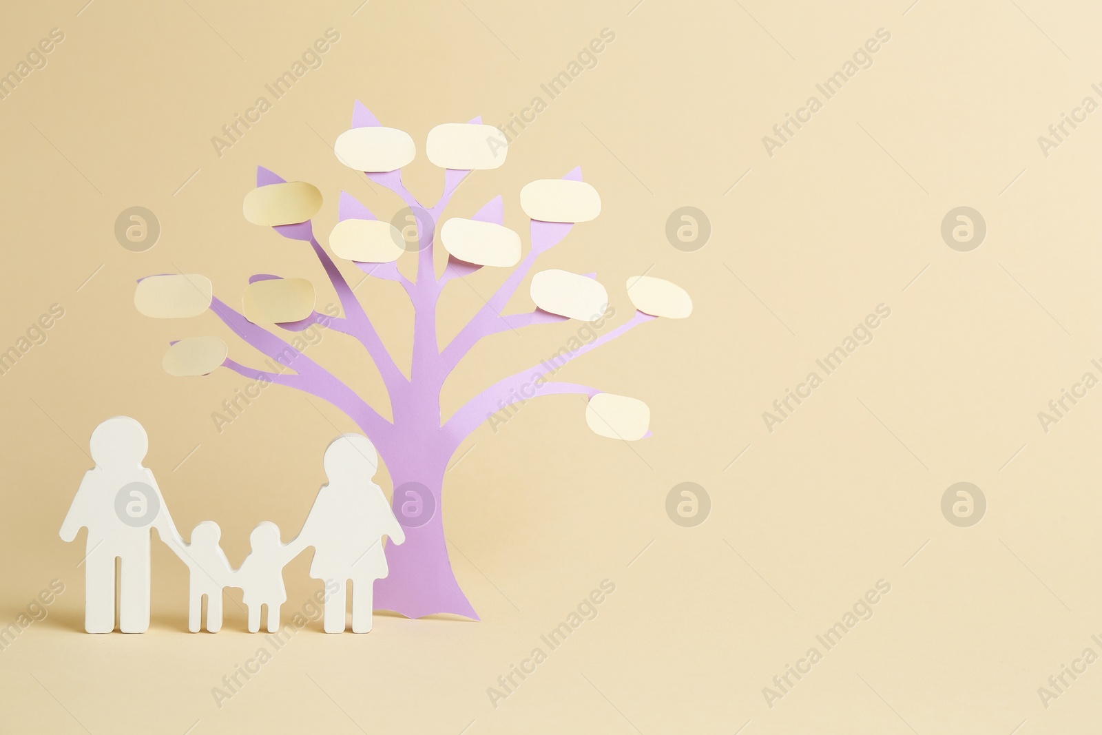Family tree with bubbles and people figure on beige background. Space for text Photo of Family tree with bubbles and people figure on beige background. Space for text