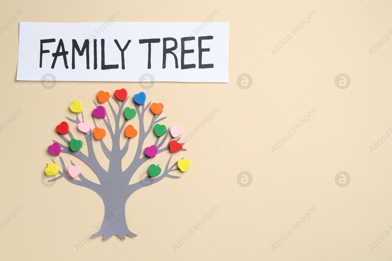 Family tree made with colorful beads on beige background, top view. Space for text Photo of Family tree made with colorful beads on beige background, top view. Space for text