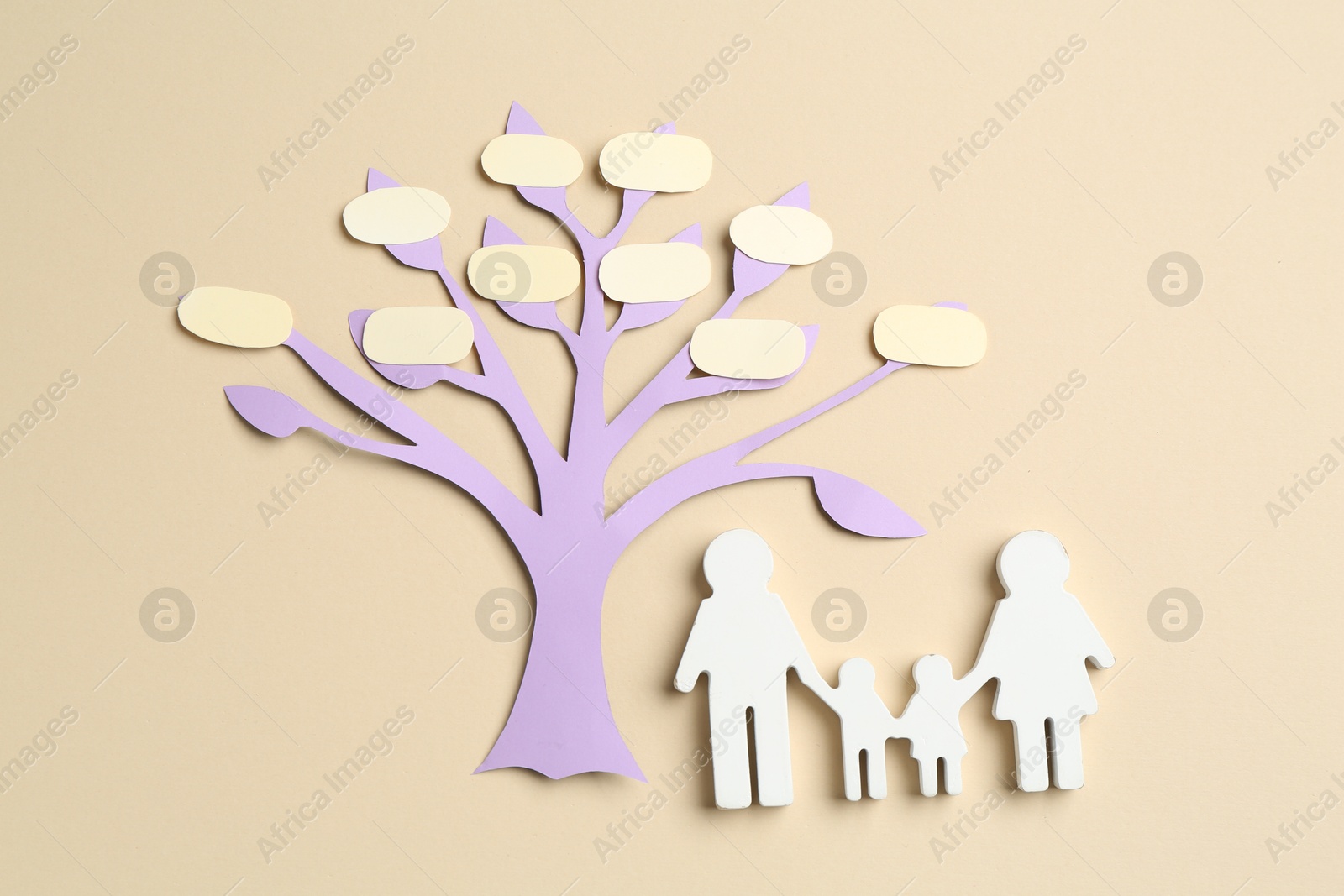 Family tree and people figure on beige background, top view Photo of Family tree and people figure on beige background, top view