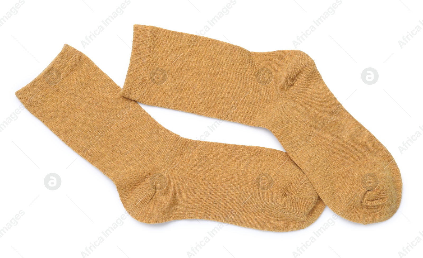 Pair of dark yellow socks isolated on white, top view Photo of Pair of dark yellow socks isolated on white, top view