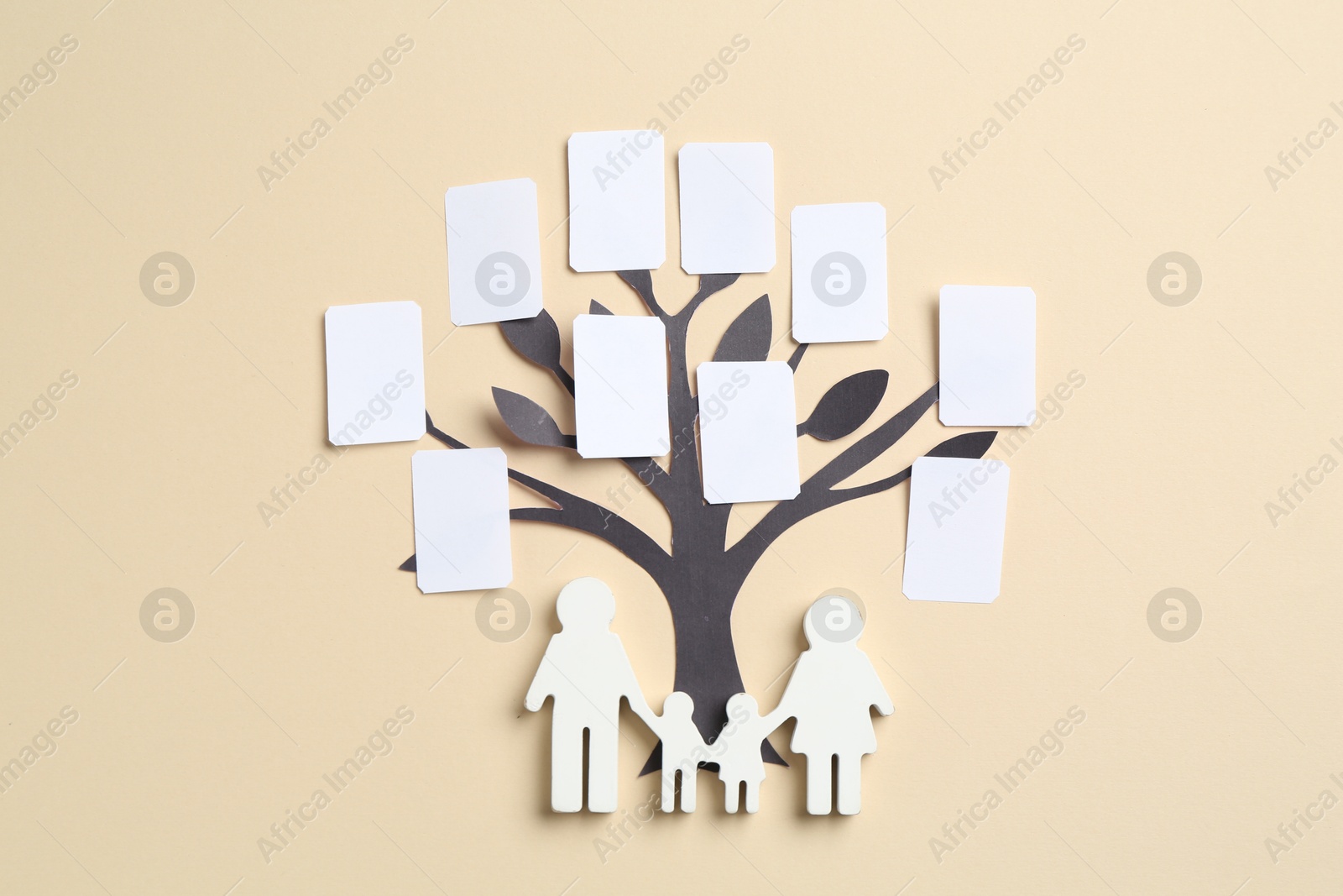 Family tree and people figure on beige background, top view Photo of Family tree and people figure on beige background, top view