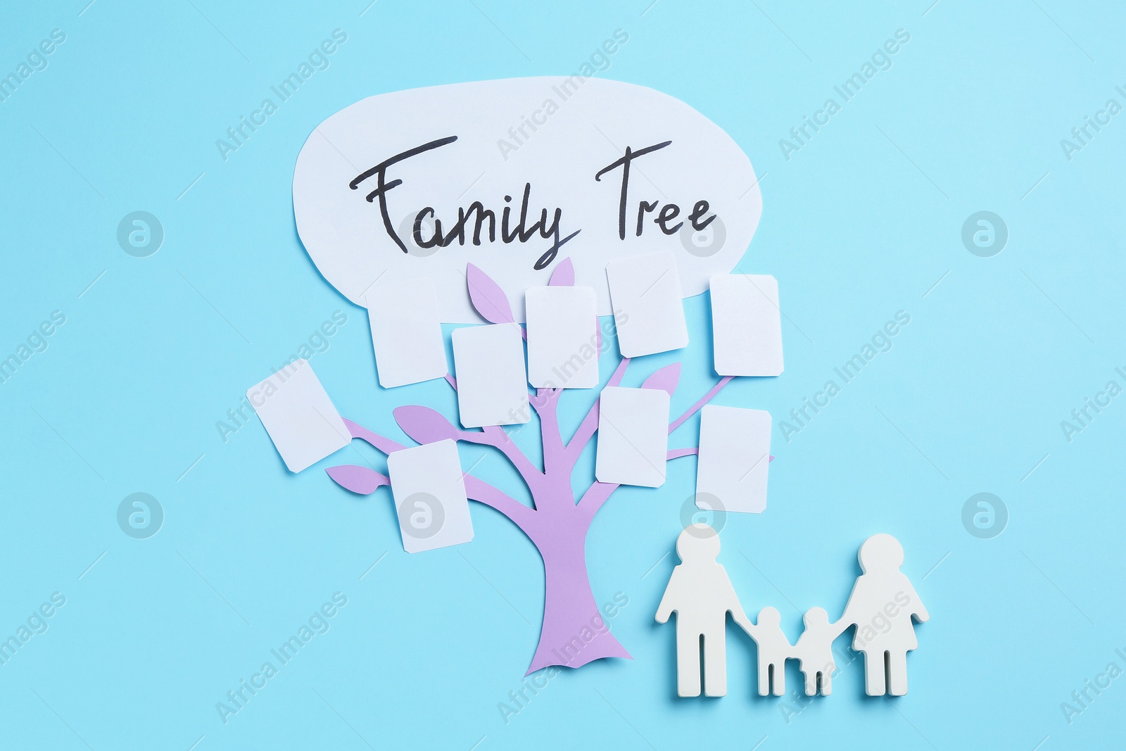 Family tree and people figure on light blue background, top view Photo of Family tree and people figure on light blue background, top view