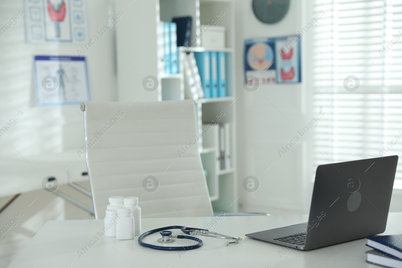 Doctor's workplace with modern laptop in office Photo of Doctor's workplace with modern laptop in office