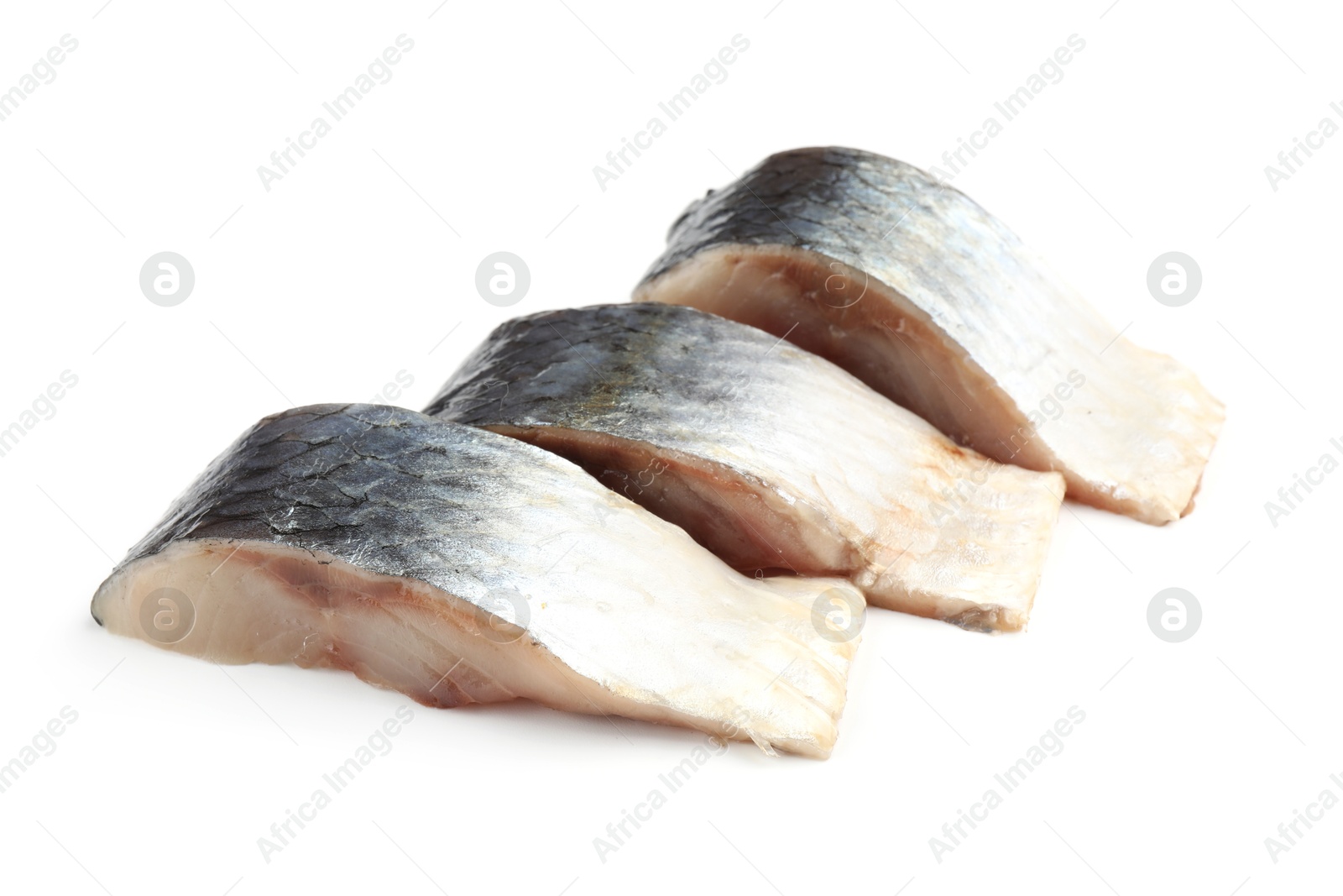 Pieces of delicious herring isolated on white Photo of Pieces of delicious herring isolated on white