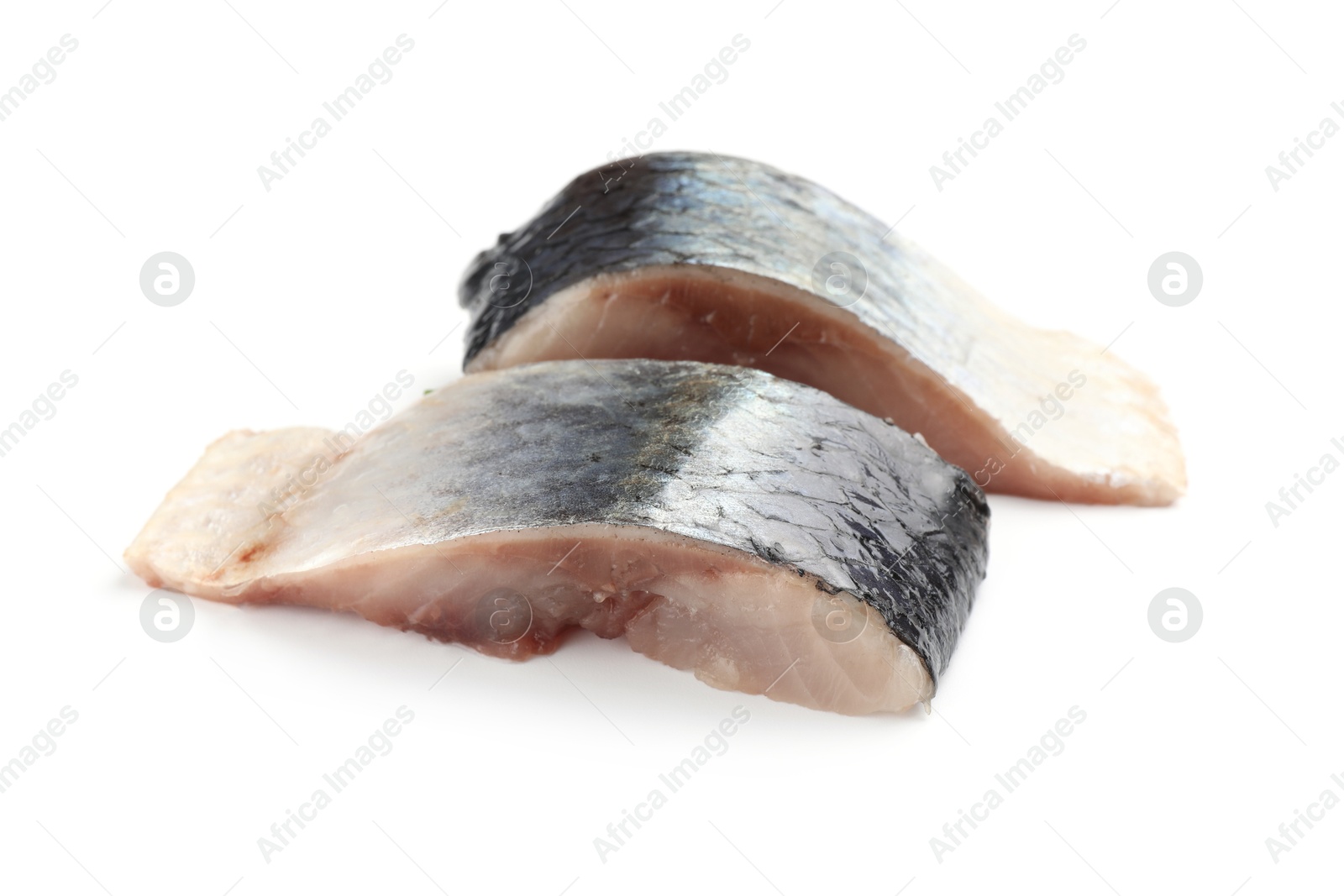 Pieces of delicious herring isolated on white Photo of Pieces of delicious herring isolated on white
