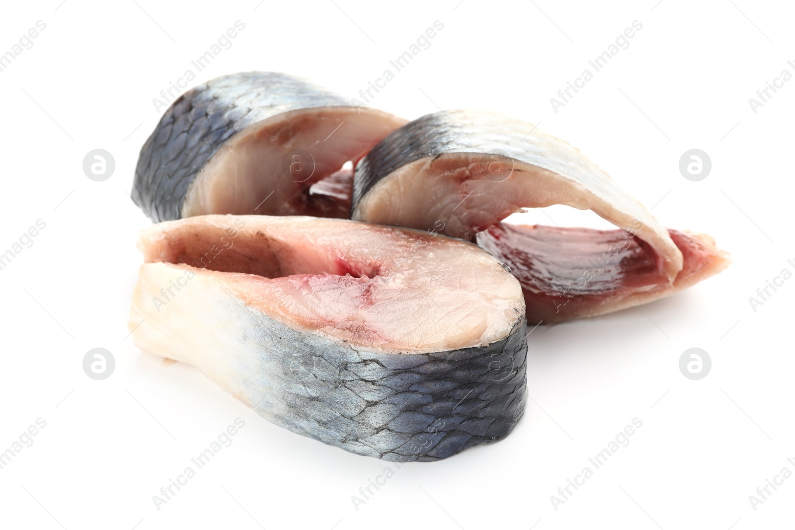 Pieces of delicious herring isolated on white Photo of Pieces of delicious herring isolated on white