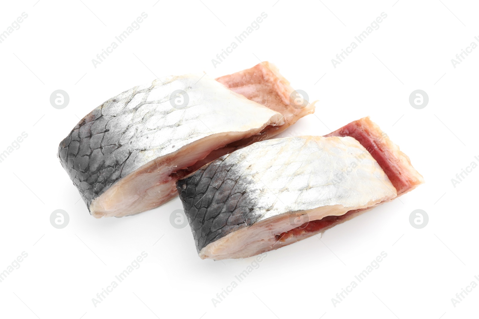 Pieces of delicious herring isolated on white Photo of Pieces of delicious herring isolated on white