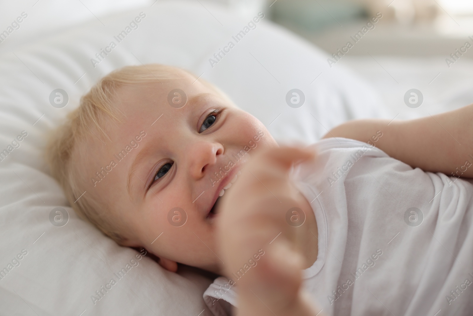 Bedtime. Cute little baby on bed at home Photo of Bedtime. Cute little baby on bed at home