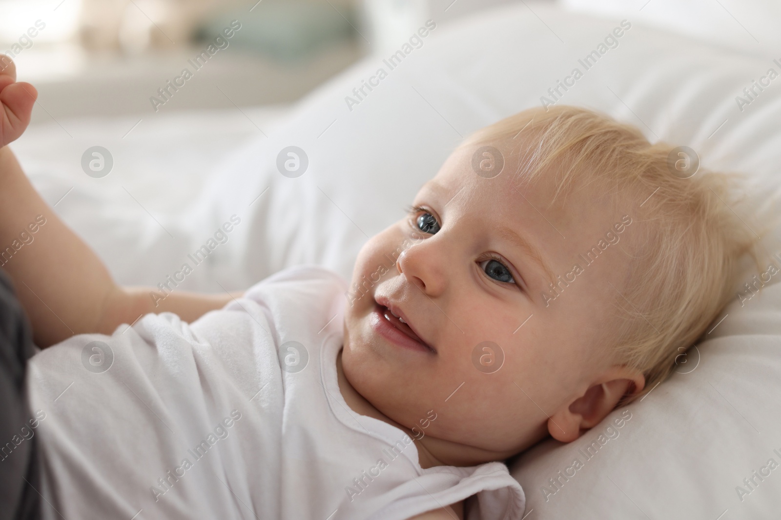 Bedtime. Cute little baby on bed at home Photo of Bedtime. Cute little baby on bed at home