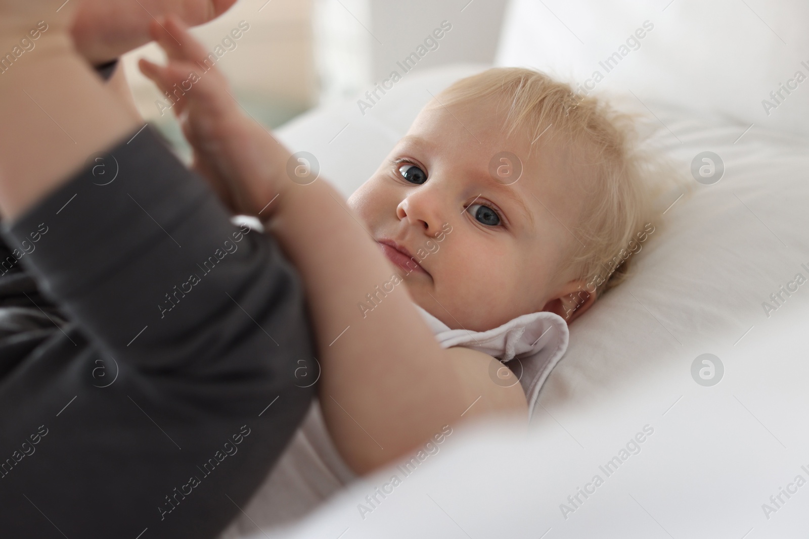 Bedtime. Cute little baby on bed at home Photo of Bedtime. Cute little baby on bed at home