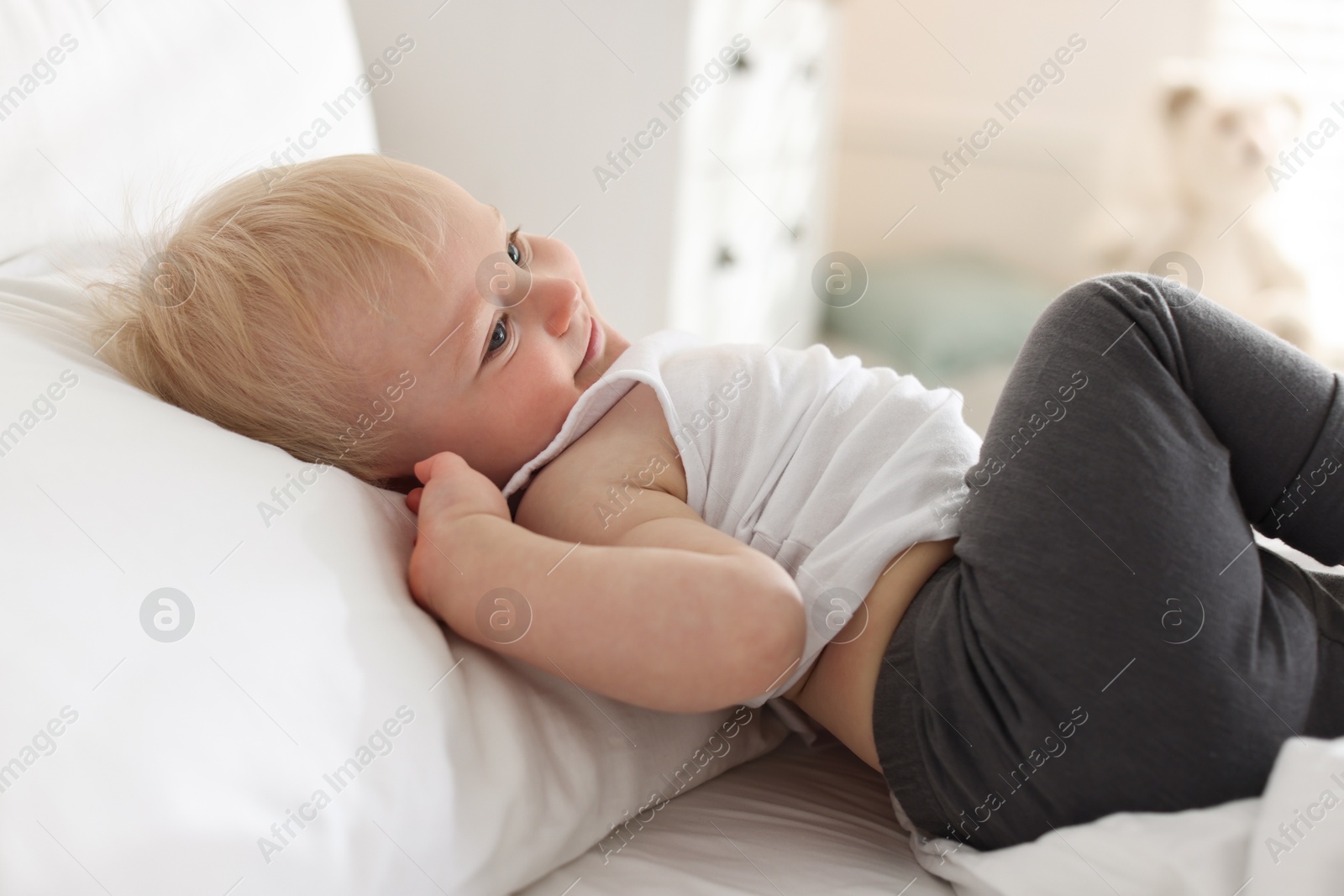 Bedtime. Cute little baby on bed at home Photo of Bedtime. Cute little baby on bed at home