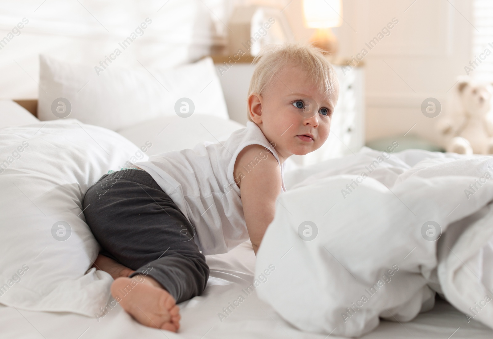 Bedtime. Cute little baby on bed at home Photo of Bedtime. Cute little baby on bed at home