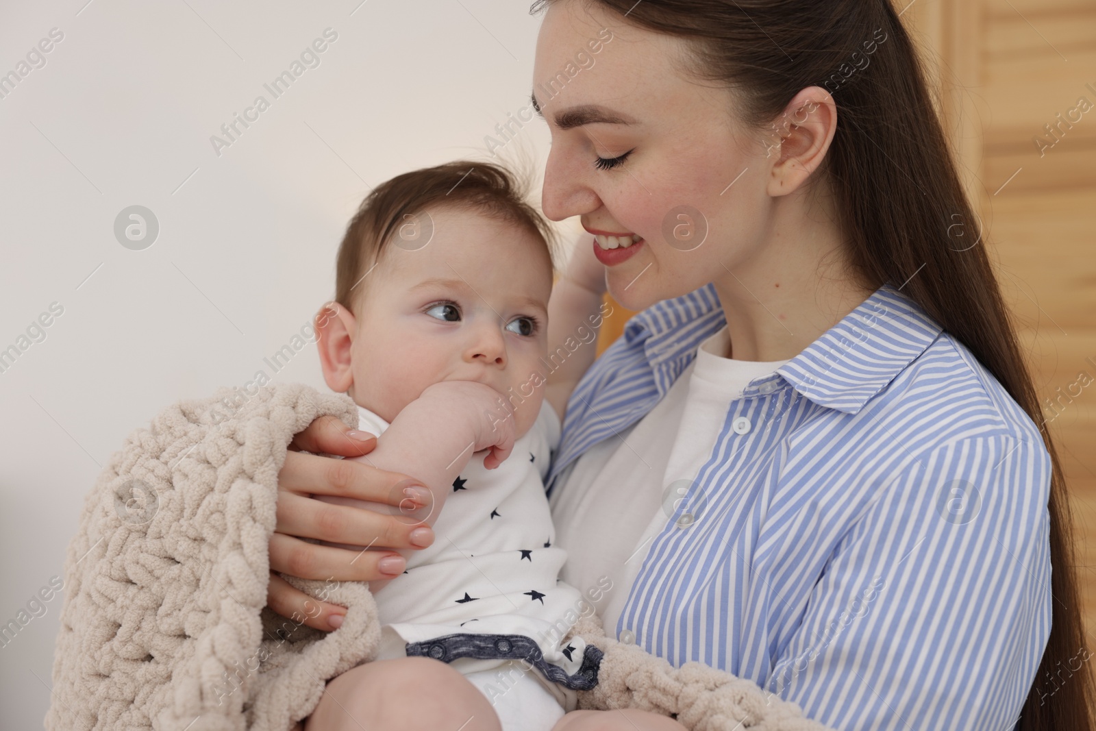 Mother with her cute little baby at home Photo of Mother with her cute little baby at home