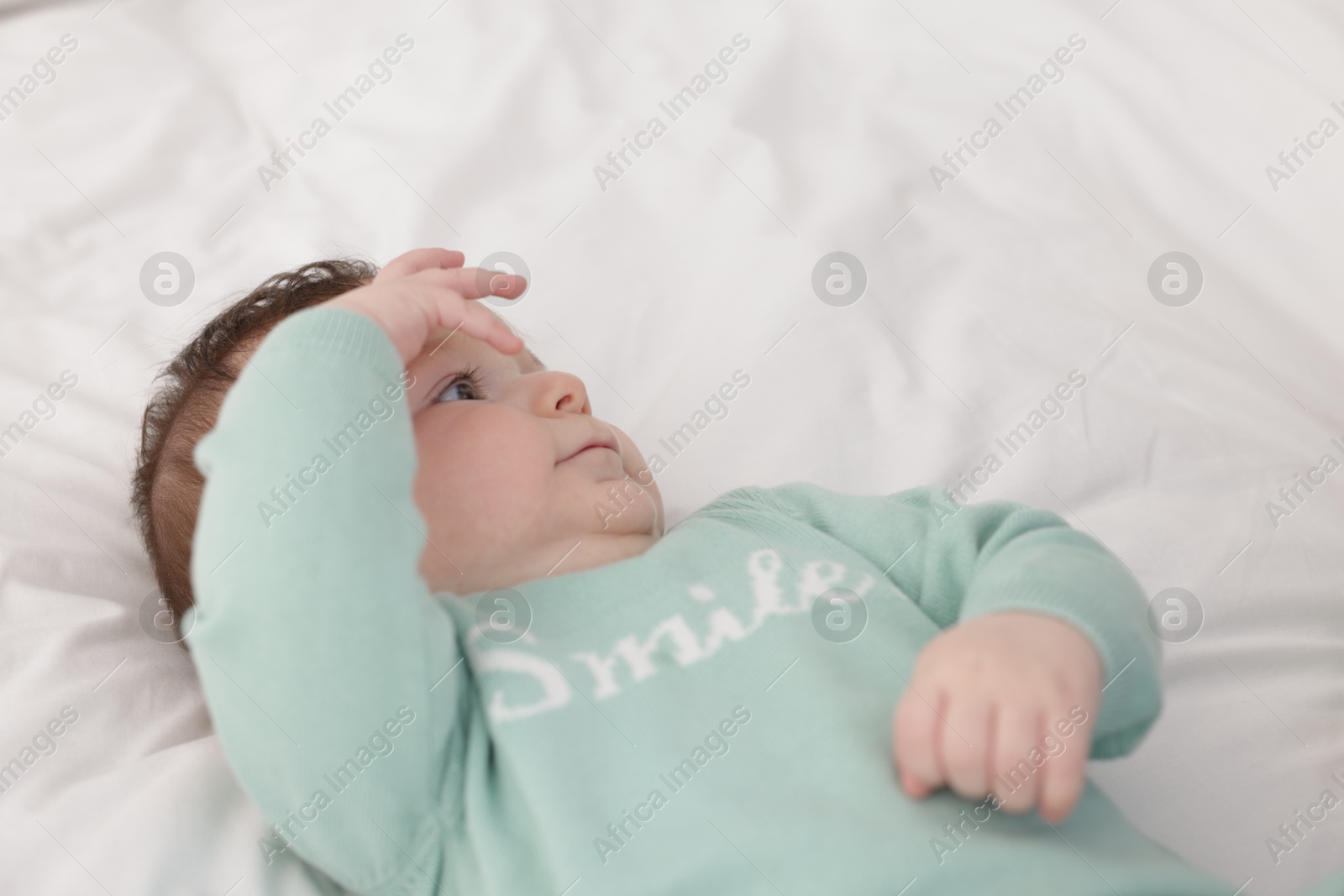 Cute little baby on bed at home Photo of Cute little baby on bed at home