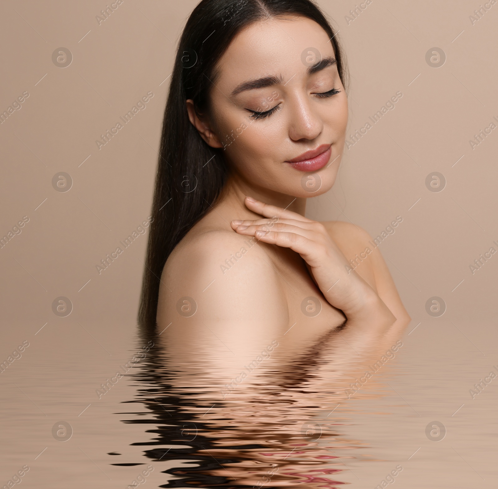 Beautiful woman in water on dark beige background Image of Beautiful woman in water on dark beige background