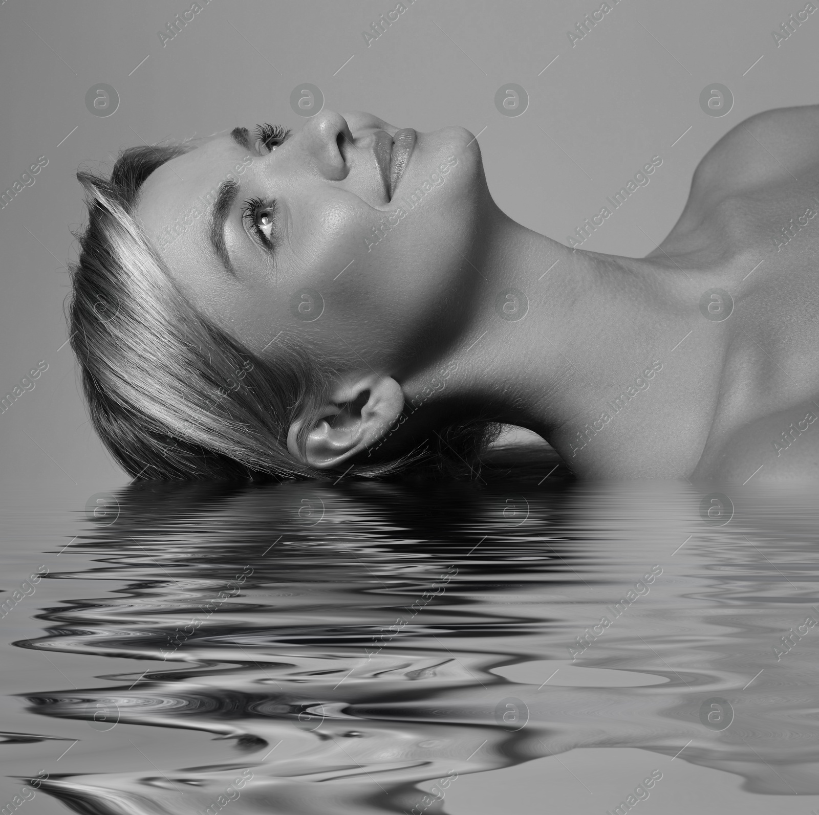 Image of Beautiful young woman in water, black-and-white toning