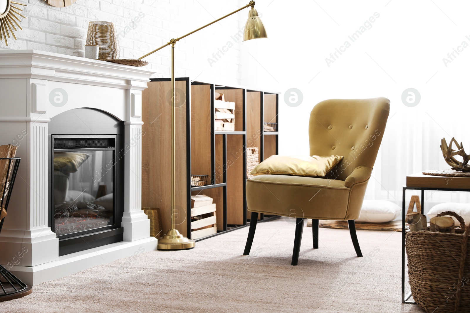Firewood and modern furniture in light living room Photo of Firewood and modern furniture in light living room