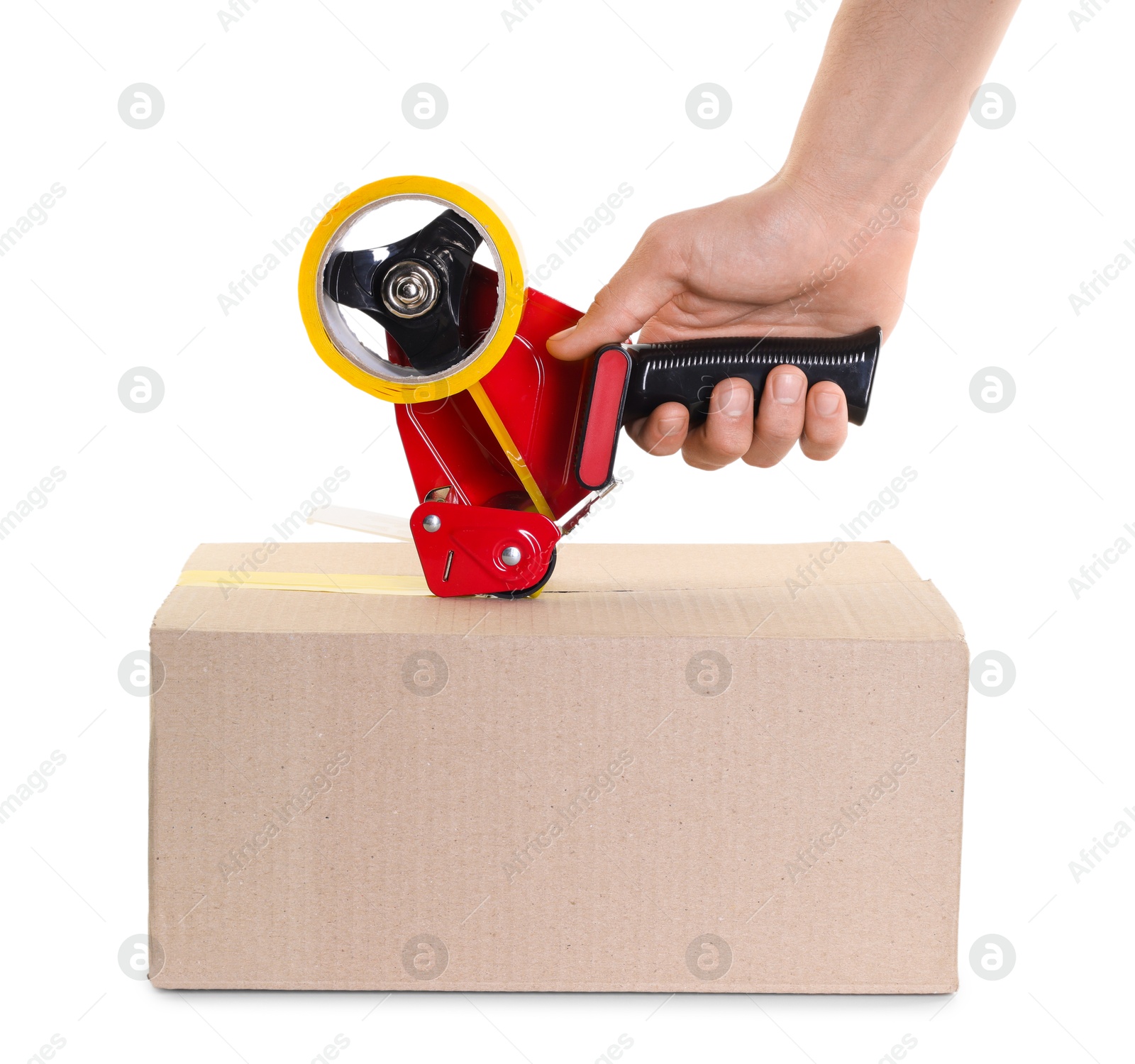 Photo of Man using dispenser with adhesive tape to seal cardboard box on white background, closeup