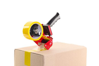 Photo of Dispenser with adhesive tape on cardboard box against white background