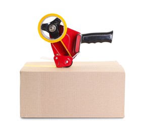 Photo of Dispenser with adhesive tape on cardboard box against white background
