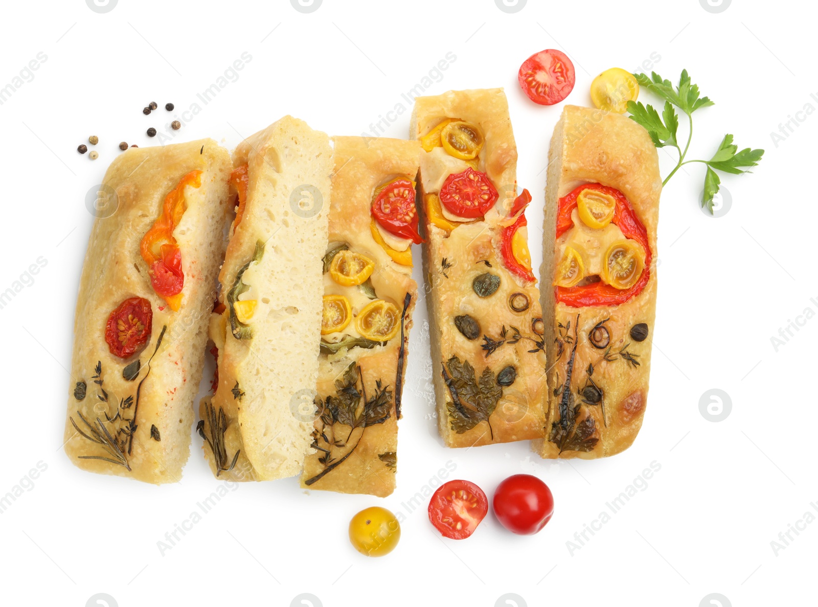 Cut delicious focaccia with flowers made of vegetables and ingredients isolated on white, top view Photo of Cut delicious focaccia with flowers made of vegetables and ingredients isolated on white, top view