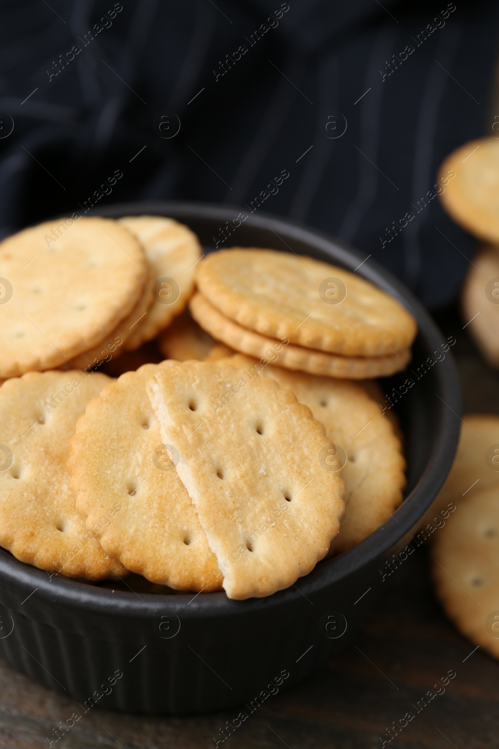 Tasty salty crackers on wooden table, closeup Photo of Tasty salty crackers on wooden table, closeup
