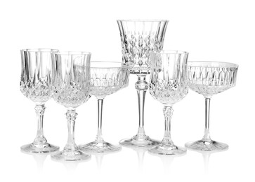 Photo of Different empty clean glasses isolated on white